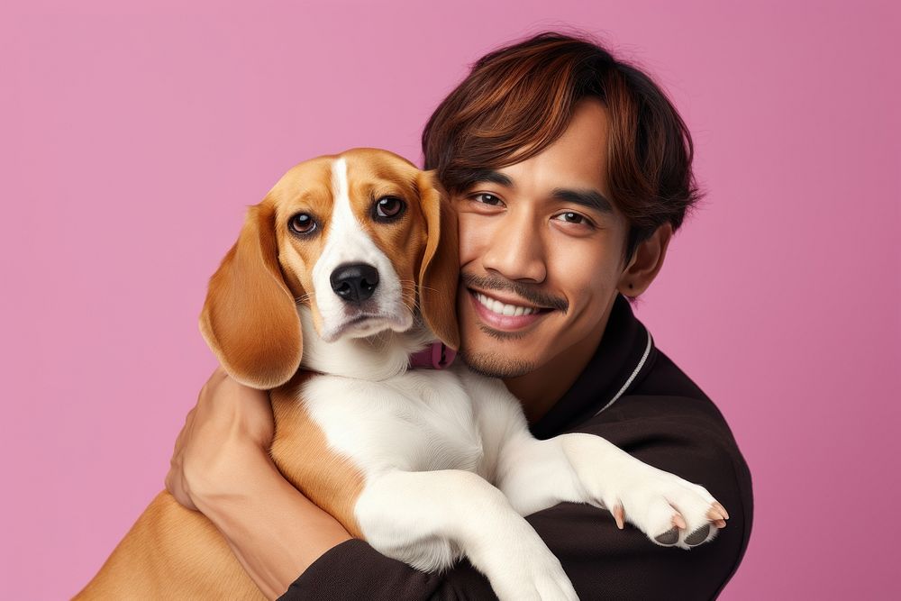 Thai man hugging beagle pet portrait animal. AI generated Image by rawpixel.