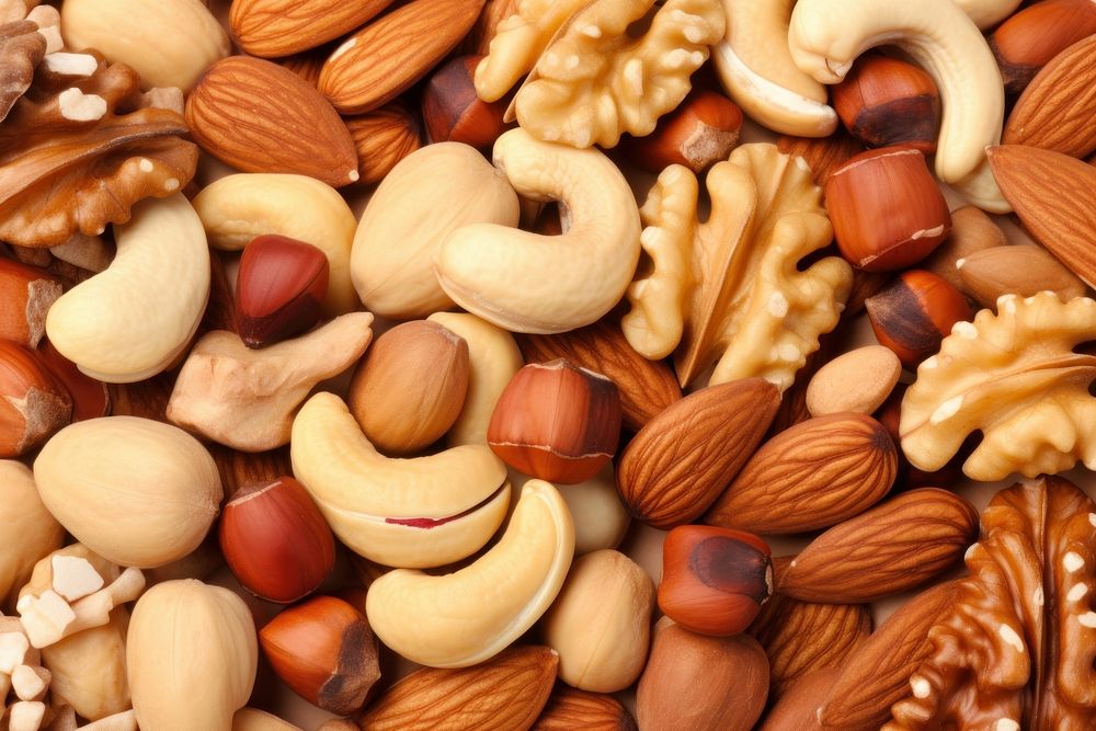 Mix nuts backgrounds food abundance. AI generated Image by rawpixel.