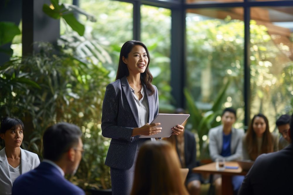 Indonesian businesswoman office adult table. AI generated Image by rawpixel.