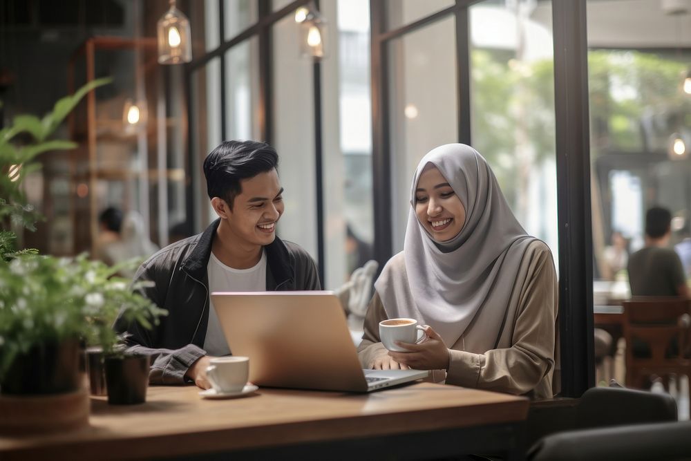 Muslim Indonesian woman laptop computer coffee. AI generated Image by rawpixel.