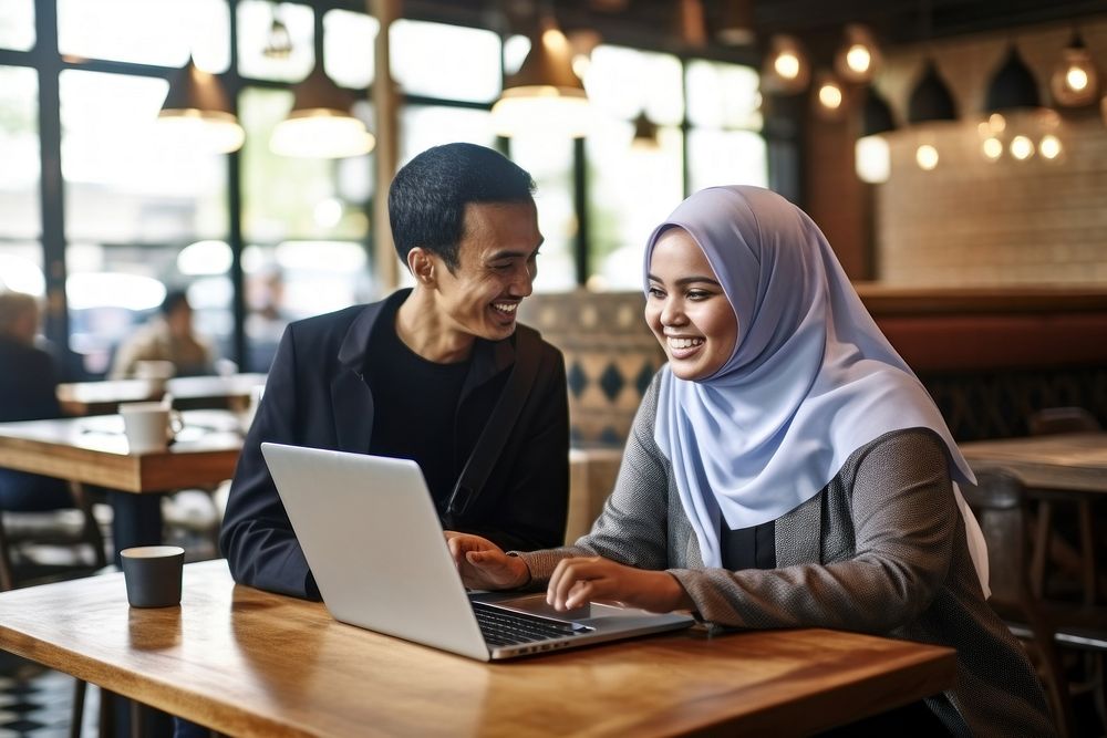Muslim Indonesian woman laptop computer coffee. AI generated Image by rawpixel.