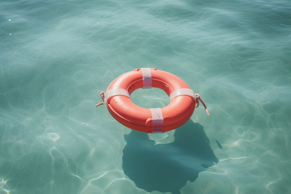 Piggy bank lifebuoy floating ocean. AI generated Image by rawpixel.