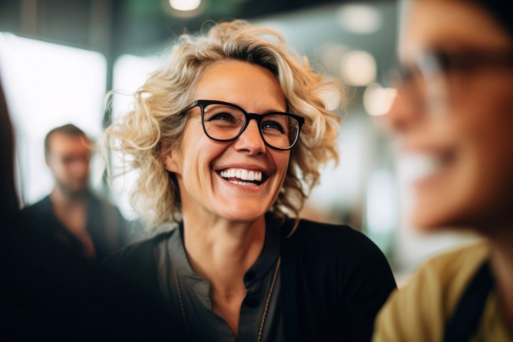 Mature businesswoman laughing glasses adult. AI generated Image by rawpixel.