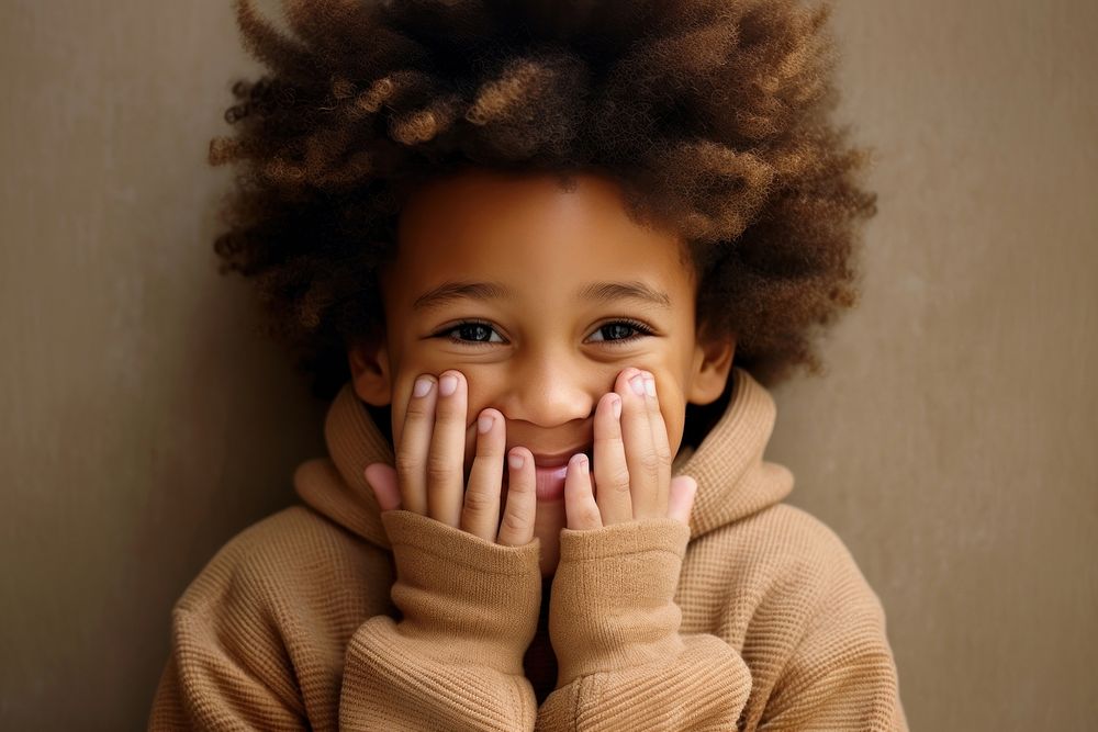 Black kid in sweater smiling portrait happy photo. AI generated Image by rawpixel.