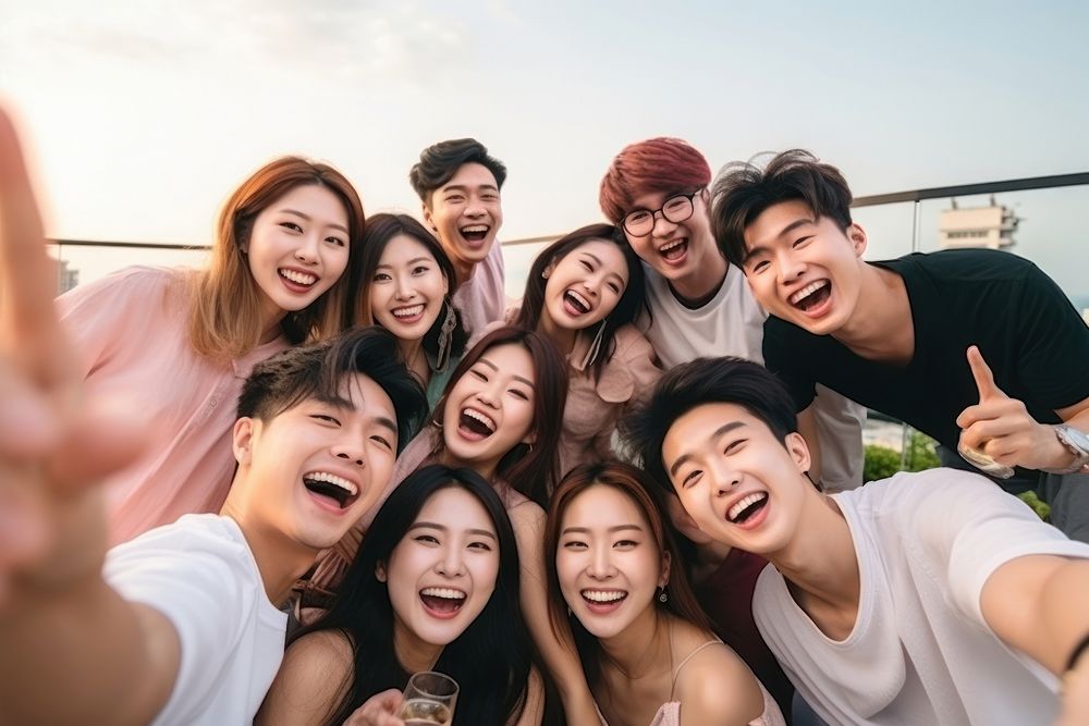 East asia friends enjoying party celebration laughing adult. AI generated Image by rawpixel.