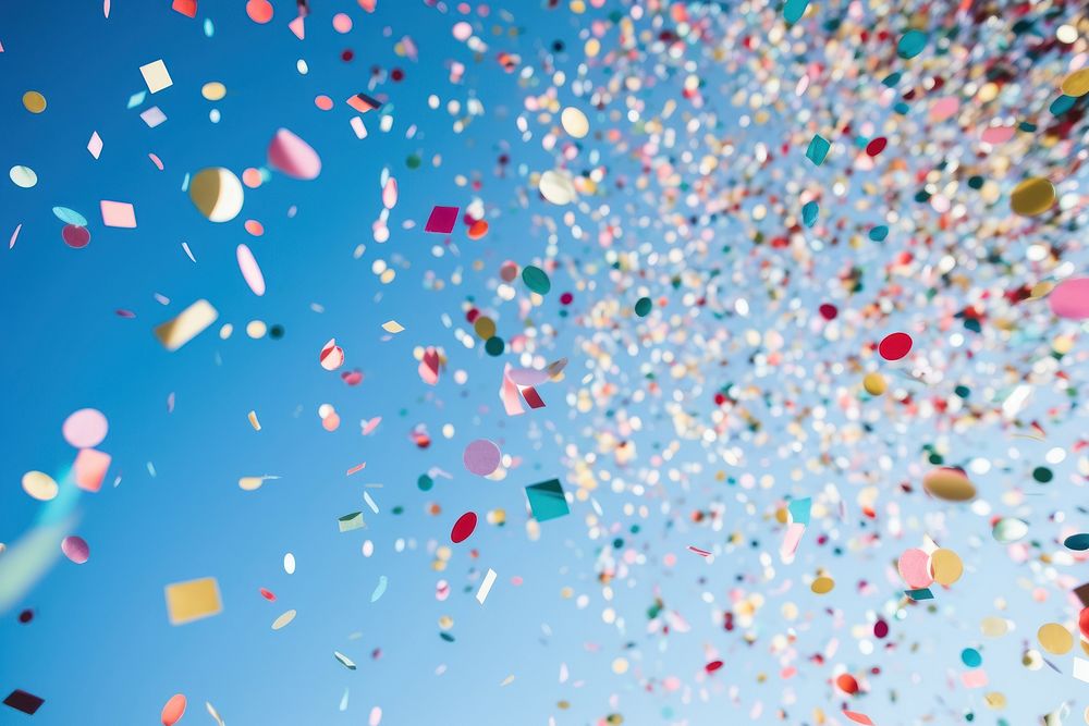 Confetti Against confetti sky low angle view. AI generated Image by rawpixel.