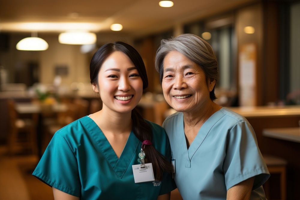 Asian Nurse helping senior woman nurse smiling adult. AI generated Image by rawpixel.