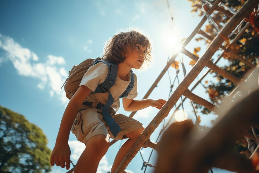 Child climbs up an alpine grid in a park on a playground on a hot summer day outdoors adult architecture. AI generated Image…