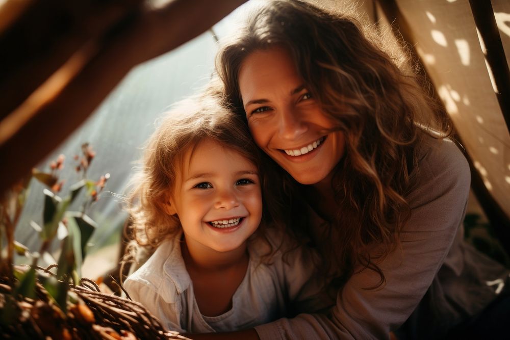 Happy family mother and daughter playing at home in a tent photography laughing portrait. AI generated Image by rawpixel.