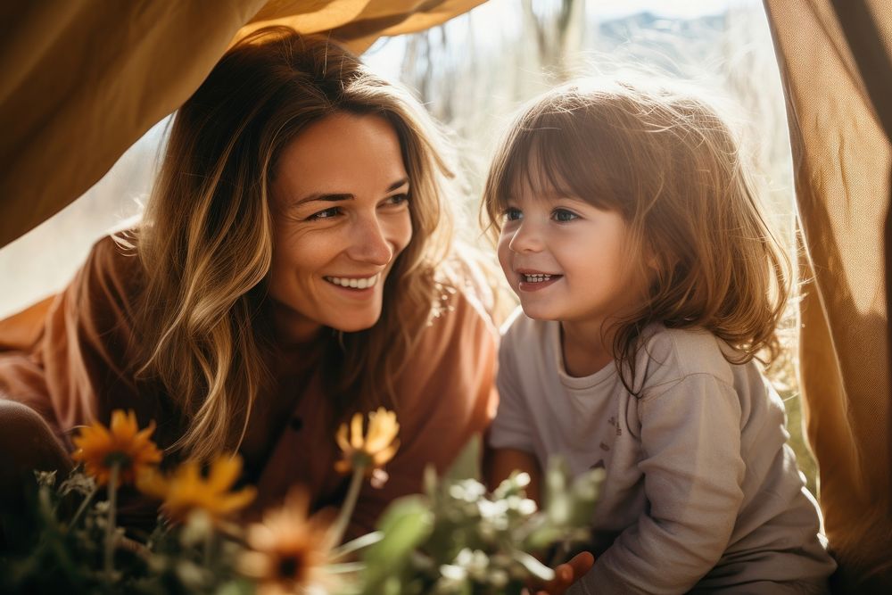 Happy family mother and daughter playing at home in a tent child laughing outdoors. AI generated Image by rawpixel.