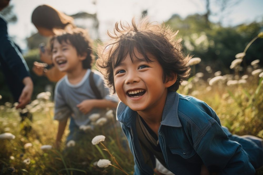 Cute asian children playing in the park laughing smile togetherness. AI generated Image by rawpixel.