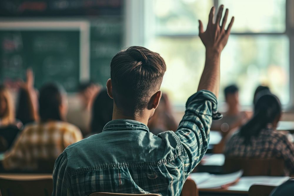 Back view of student raising his hand classroom education school. AI generated Image by rawpixel.