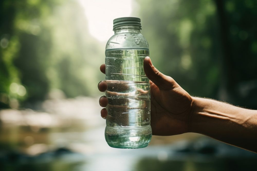 Water bottle holding hand refreshment. AI generated Image by rawpixel.