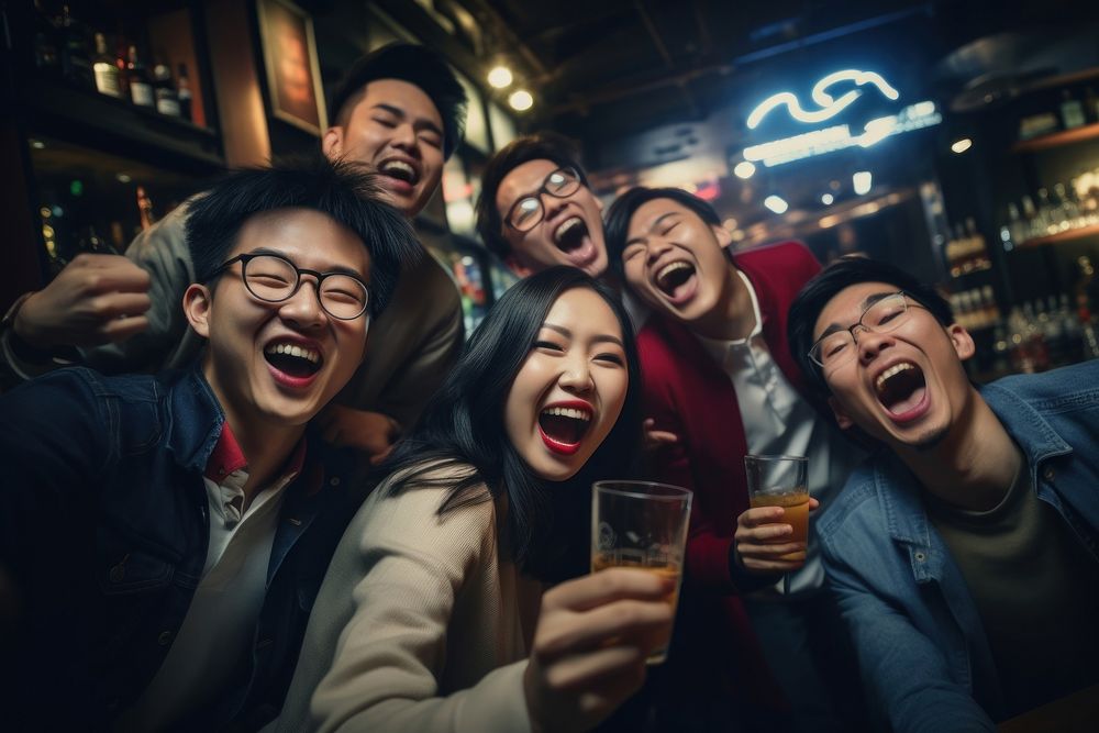 Asian friends having fun on night out celebration laughing adult. AI generated Image by rawpixel.