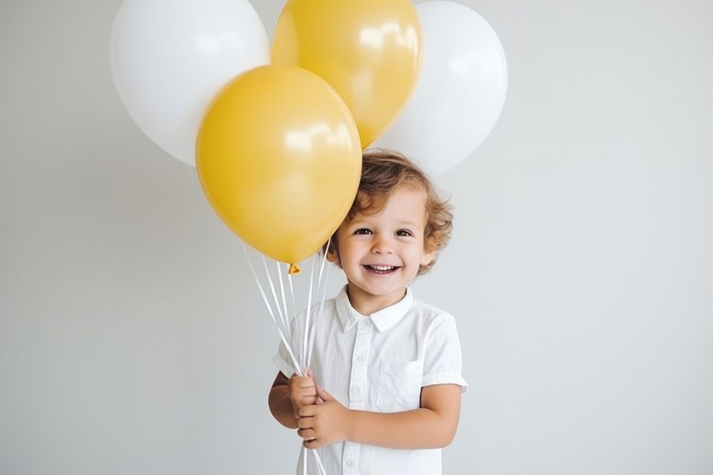 Latino little baby boy birthday balloon smile. AI generated Image by rawpixel.