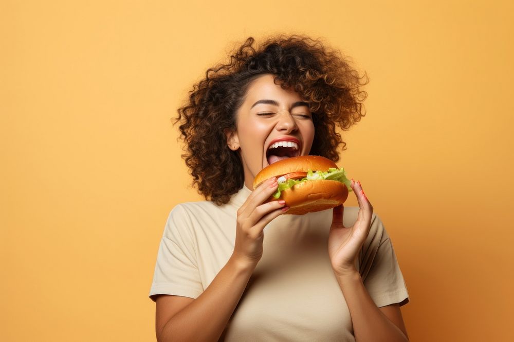 Woman eating hamburger adult food happiness. AI generated Image by rawpixel.