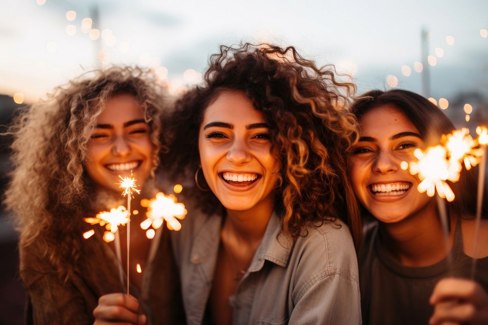 Latina young women sparkler laughing sparks. AI generated Image by rawpixel.