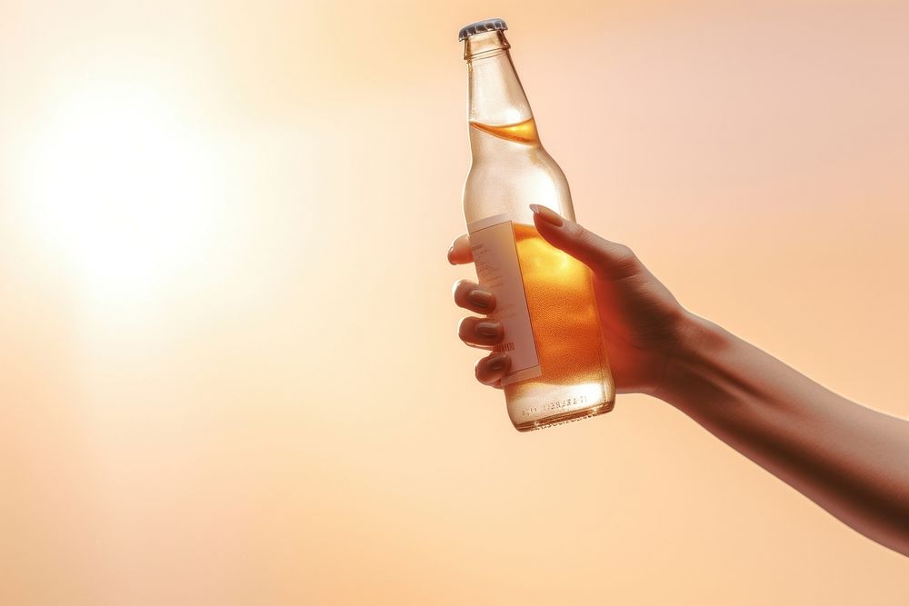 Hand holding beer bottle drink glass condensation. AI generated Image by rawpixel.