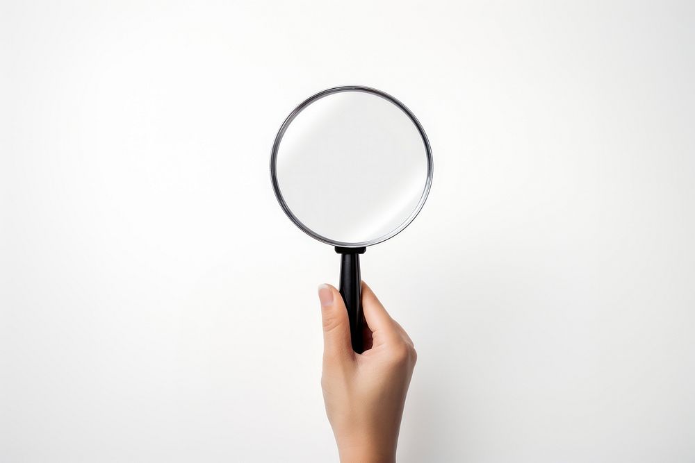 Hand holding a magnifying glass photo white background photography. AI generated Image by rawpixel.