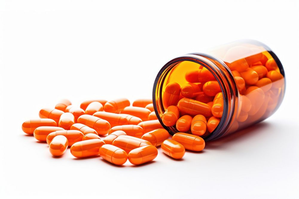 Pills in bottle capsule white background orange color. AI generated Image by rawpixel.