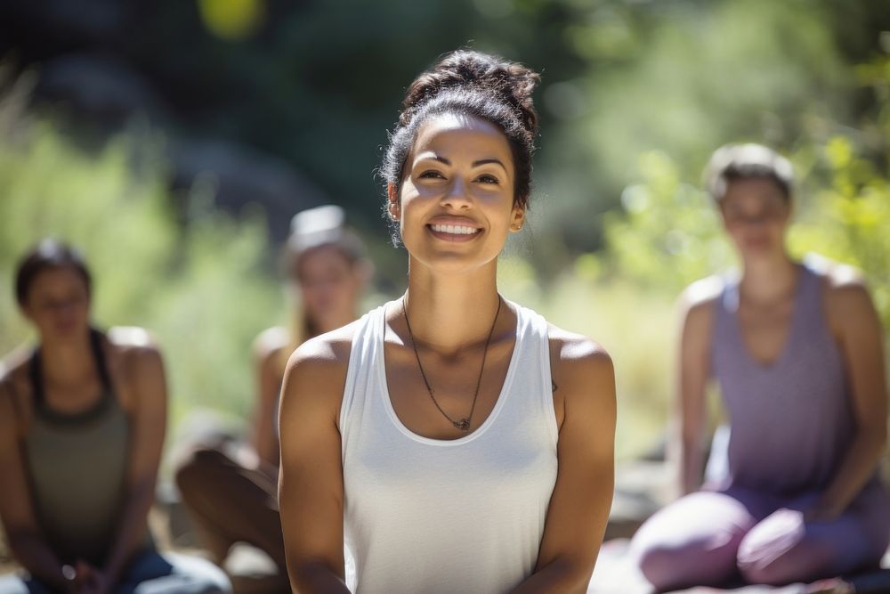 A Latino yoga instructor leading a serene outdoor summer yoga session sunlight outdoors adult. AI generated Image by…