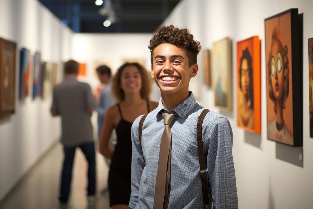 A Latino student showcasing artwork in a high school summer art exhibition creativity painting adult. AI generated Image by…