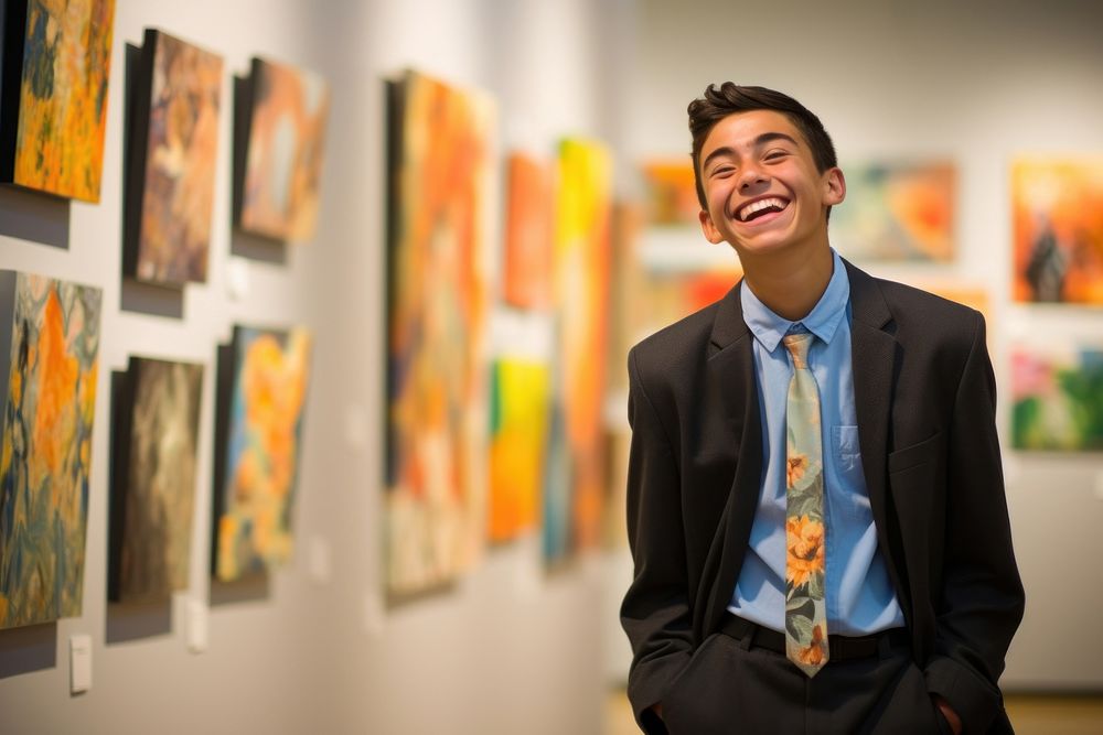 A Latino student showcasing artwork in a high school summer art exhibition creativity adult men. AI generated Image by…