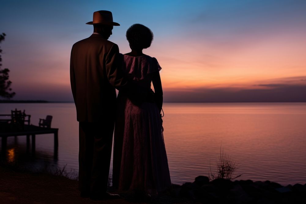 Black couple standing outdoors evening. AI generated Image by rawpixel.