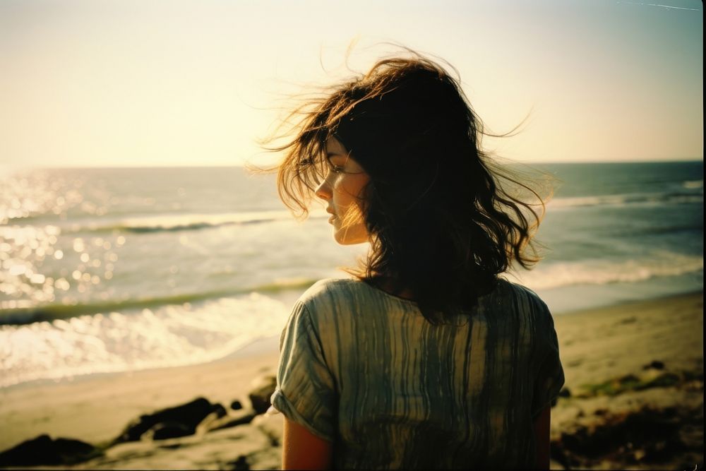 A woman at the beach photography portrait outdoors. AI generated Image by rawpixel.