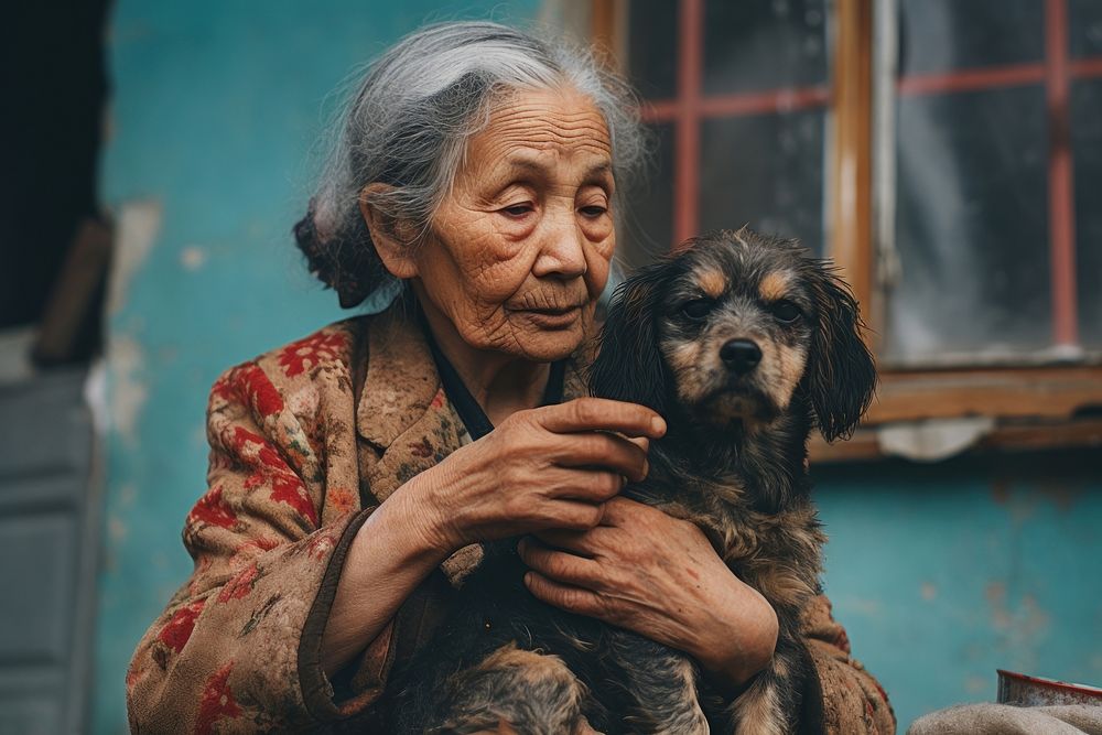 A puppy with an old woman animal mammal adult. AI generated Image by rawpixel.