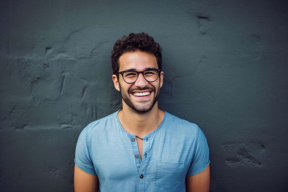 Happy smiling man in glasses laughs at wall laughing portrait adult. AI generated Image by rawpixel.