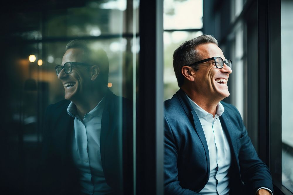 Man in glasses smiling laughing at a window adult smile human. AI generated Image by rawpixel.