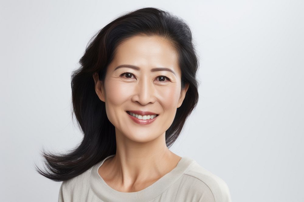 Middle aged modern chinese woman adult smile white background. AI generated Image by rawpixel.