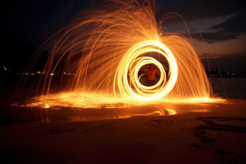 Fireshow at the beach in thailand light fireworks outdoors. AI generated Image by rawpixel.
