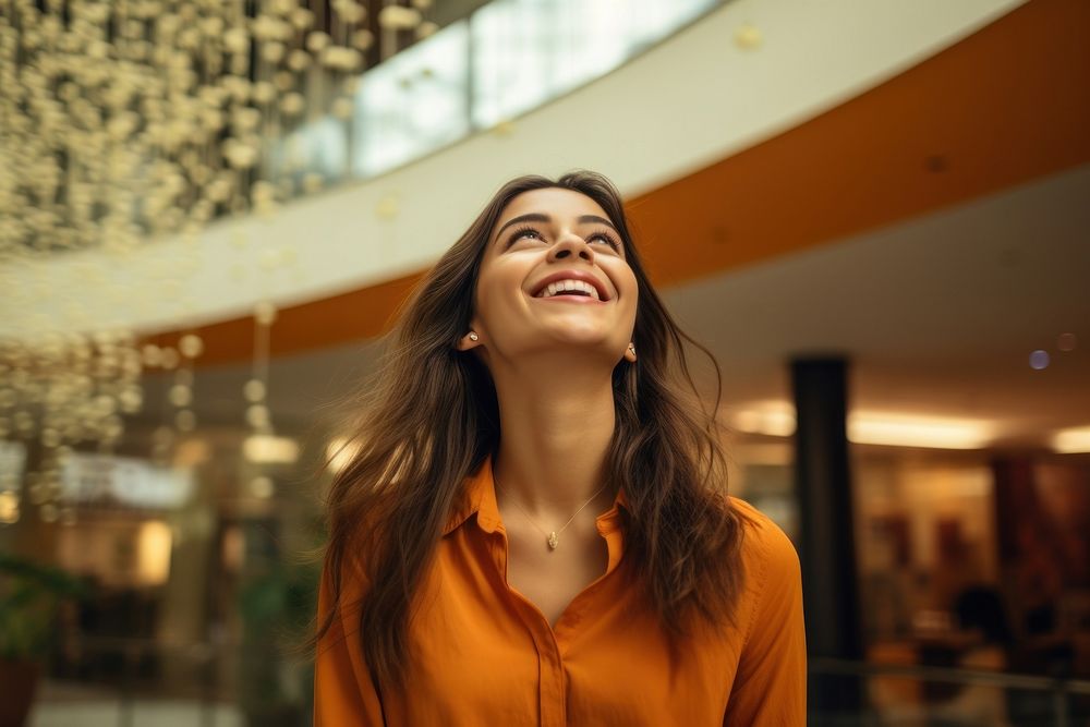 Happy latina in shopping mall laughing smile adult. AI generated Image by rawpixel.