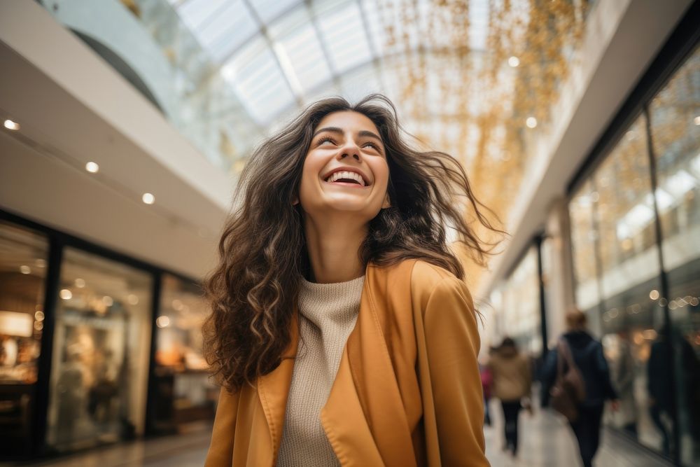 Happy latina in shopping mall laughing smile adult. AI generated Image by rawpixel.