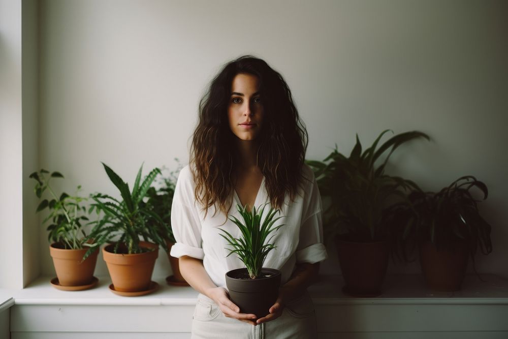 Woman plant houseplant window. AI generated Image by rawpixel.