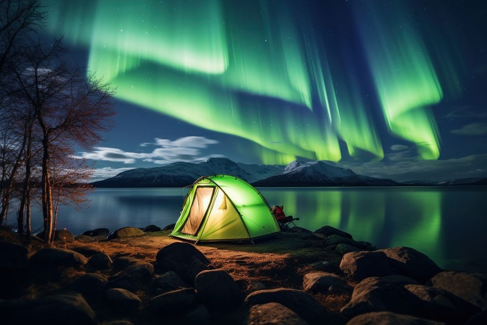 Aurora lights camping tent outdoors. AI generated Image by rawpixel.