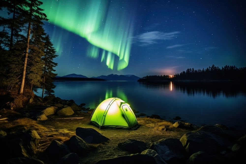 Aurora lights camping tent outdoors. AI generated Image by rawpixel.