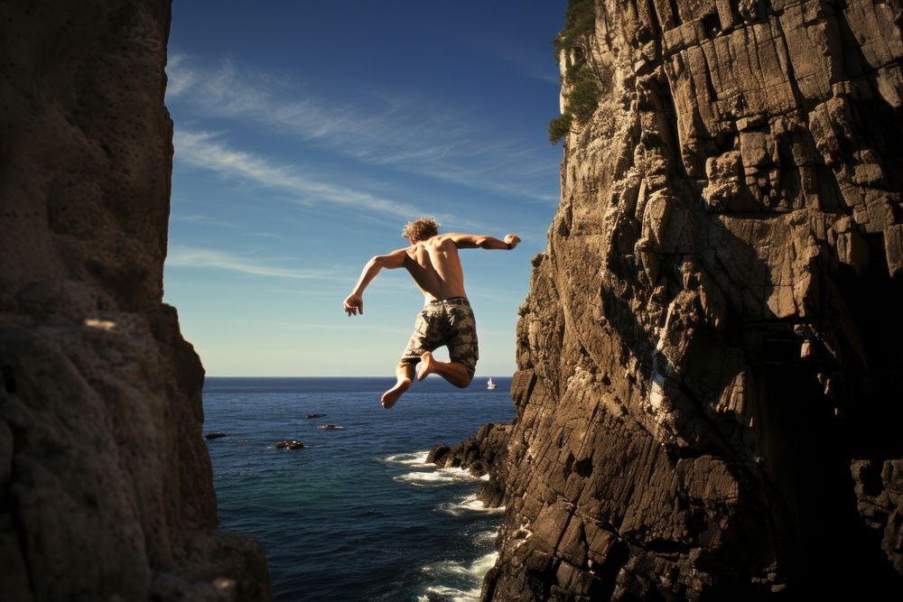 Cliff diving outdoors nature ocean. AI generated Image by rawpixel.