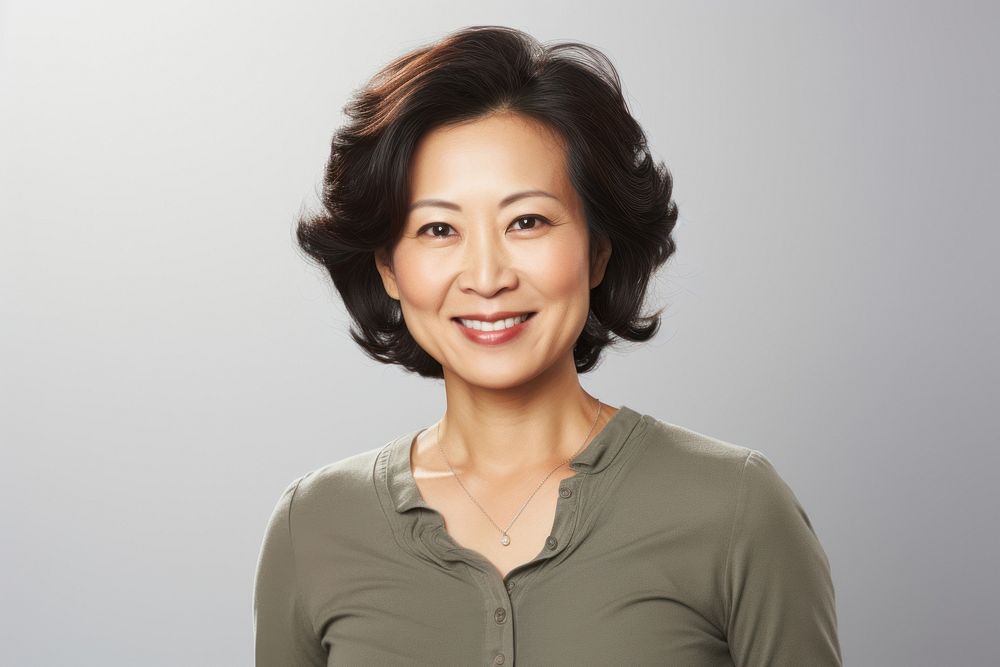 Portrait of a middle aged asian woman adult smile white background. AI generated Image by rawpixel.