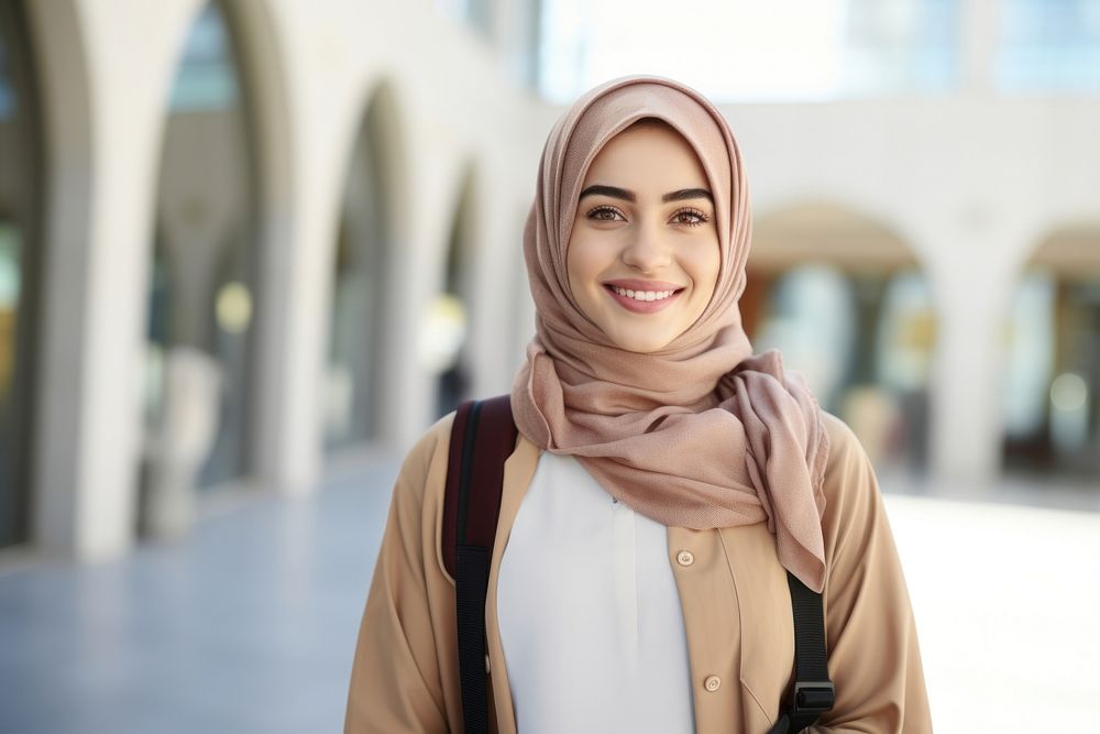 Qatar female student person scarf smile. 
