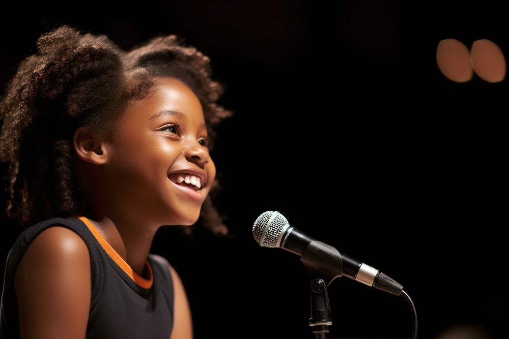 10 years old African American student girl speaker microphone smiling stage. AI generated Image by rawpixel.