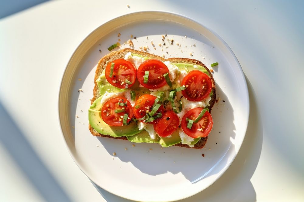 Avocado toast plate tomato food. AI generated Image by rawpixel.
