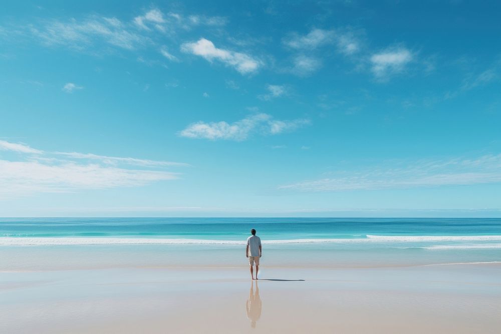 A person standing on a beach outdoors horizon walking. AI generated Image by rawpixel.