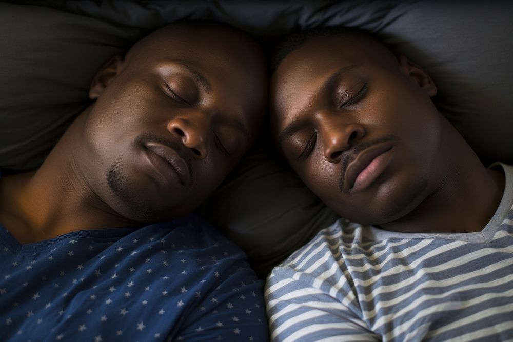 Two black man sleeping on pride bed portrait photo togetherness. AI generated Image by rawpixel.