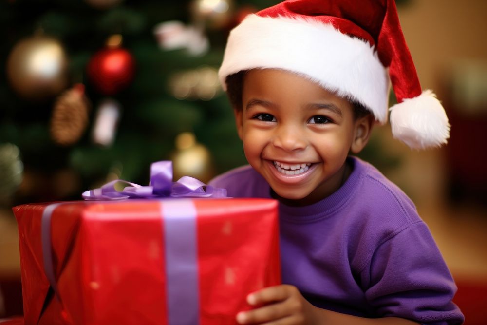 Kid opening chirstmas gift christmas baby anticipation. AI generated Image by rawpixel.
