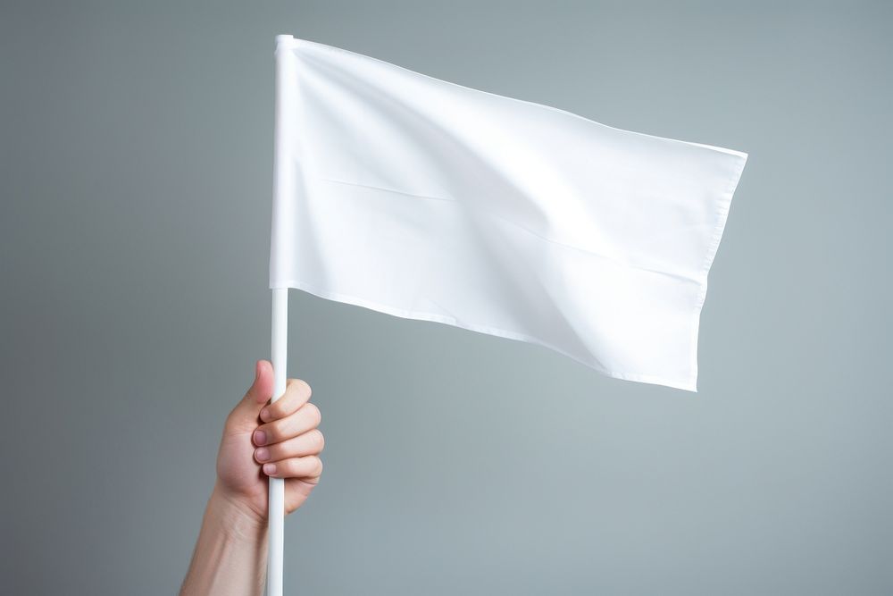 White flag holding hand patriotism. AI generated Image by rawpixel.