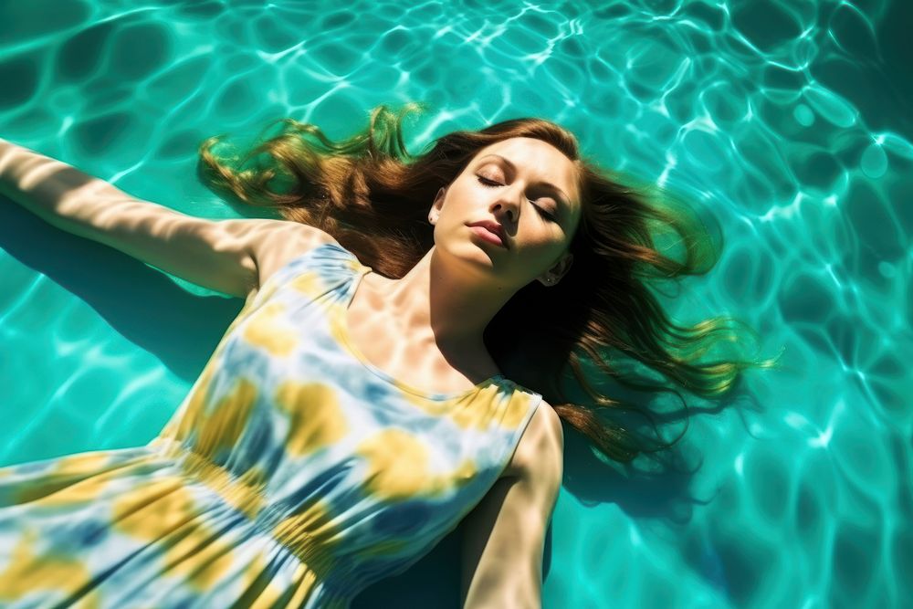 Woman lay down underwater swimming portrait outdoors. AI generated Image by rawpixel.