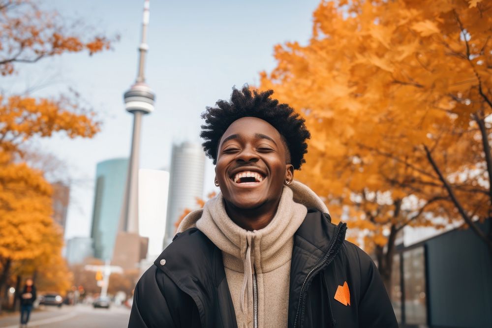 A African exchange student in Toronto architecture laughing adult. AI generated Image by rawpixel.
